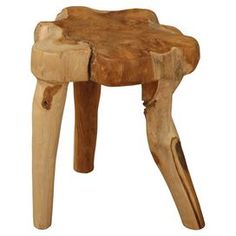 a small wooden stool made out of wood with an animal's head on it