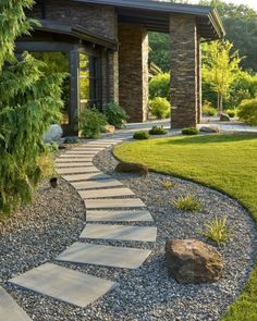 a stone path in front of a house