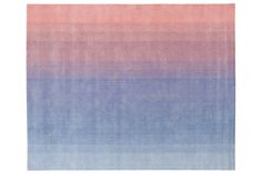 a blue and pink rug with horizontal stripes