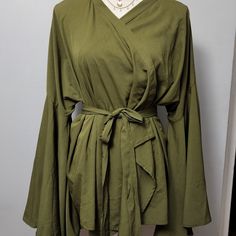 Flare Sleeves; Wrap Closure With A Matching Belt; Olive Green Casual Green Wrap Blouse, Casual Green Wrap Top, Olive Long Sleeve Blouse For Spring, Solid Wrap Top For Spring, Casual Wrap Blouse For Spring, Long Length Blouse, Plunge Blouse, Spaghetti Strap Bodysuit, Satin Cami Top