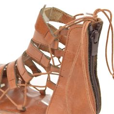 COLOR: Tan LEATHER TYPE: Vegetable Leather MATERIAL: Made from %100 leather. SOLE: Leathery IN SOLE : %100 leather. HEEL HEIGHT: 1.5 cm DESIGN: Lace-up & Zippered GENDER: Women's The FIBO Hera Tan Leather Sandal is expertly crafted with %100 leather, a zipper back closure, and an ergonomic heel design for comfort. These shoes are handcrafted and expertly stitched by skilled artisans for a unique pair of sandals. Tan Leather Sandals, Insole Design, Vegetable Leather, Heel Design, Eternity Band Ring, Leather Sandals Women, Designer Heels, Women's Sandals, Natural Leather