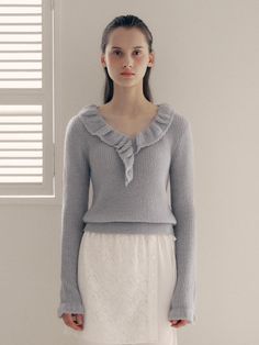 This frill collar knit top is perfect for adding a touch of loveliness to your outfit. It features frill detailing at the neckline and cuffs, exuding feminine mood.- Cropped length that makes your look stylish- Falls slimly on the body with an elastic waistband for a flattering fit- Versatile color for easy everyday wear without feeling burdensome Chic Winter Knit Top With Ruffles, Chic Winter Tops With Ruffles, Chic Ruffled Winter Tops, Chic Ruffled Tops For Winter, Elegant Knit Sweater With Ruffles, Spring Feminine Sweater With Ruffles, Elegant Knit Tops With Ruffles, Feminine Ruffled Sweater For Spring, Elegant Ruffled Knit Tops