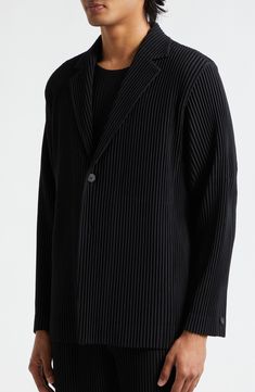 The Japanese label takes a forward-thinking approach to this single-breasted blazer expertly designed with Issey Miyake's signature wrinkle-resistant pleats 29" length (size 2) Front button closure Notched lapels One-button cuffs Unlined 100% polyester Dry clean or machine wash, line dry Imported Designer Clothing Asian Owned/Founded Black Structured Outerwear For Office, Structured Black Blazer For Business, Formal Pleated Blazer For Fall, Pleated Formal Blazer For Fall, Structured Black Blazer For Work, Pleated Long Sleeve Formal Outerwear, Formal Pleated Long Sleeve Blazer, Formal Pleated Winter Outerwear, Winter Formal Pleated Outerwear