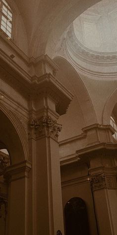 the interior of an old building with arched windows