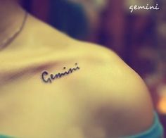 a woman's chest with the word genius written in cursive writing on it