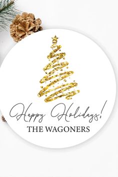 a christmas ornament that says happy holidays the wagonners with a gold tree on it