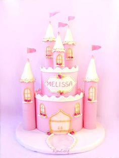 a pink princess castle cake with the name mellisa on it's side