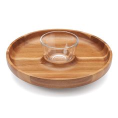 a wooden plate with a glass on it