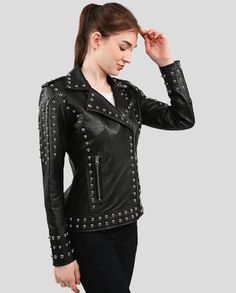 Women's Studded Leather Biker Jacket In Black This women's studded leather biker jacket is crafted from real leather and features high-quality studs. It also has a zippered closure, notched collar with snap button, two side zip pockets and an interior pocket. The black color is perfect for any occasion. Outer Shell: Real Leather Leather Type: Cowhide Leather Finish: Semi-anilineWomen's Studded Leather Biker Jacket Inner Shell: Viscose Lining Features: High-Quality Studs. Each Securely Added By H Black Leather Jacket With Spikes And Long Sleeves, Black Leather Jacket With Spikes, Black Biker Jacket With Spikes For Fall, Black Leather Jacket With Spikes For Fall, Gothic Leather Jacket With Studs, Gothic Leather Jacket With Spikes For Winter, Biker Leather Jacket With Spikes For Fall, Fitted Winter Leather Jacket With Rivets, Fitted Biker Outerwear With Studs