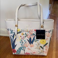 Nanette Lepore Tote Mekena Shopper Bag In Summer Botanical This Beautiful Tote Has An Inside Zipper, Two Inside Slip Pockets And Two Outside Pockets. It Is A Lovely Floral Pattern!! 12 In X 10 In X 4 In Feminine Shoulder Bag For Spring Errands, Chic Floral Print Shoulder Bag For Shopping, Spring Floral Print Double Handle Shoulder Bag, Spring Floral Print Cream Bags, Feminine Floral Print Everyday Bags, Elegant Everyday Shoulder Bag With Floral Print, Everyday White Shoulder Bag With Floral Print, White Floral Print Shoulder Bag For Travel, Everyday White Floral Print Shoulder Bag