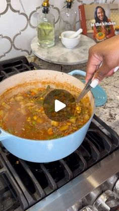 a person stirring a bowl of soup on the stove