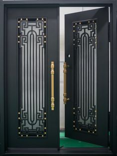 two black doors with gold handles and decorative designs on the front, side and sides