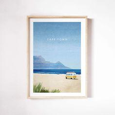 a framed poster with the words cafe town on it in front of a white wall