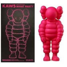 a pink bear toy next to an advertisement for kaws