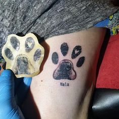 a dog's paw is shown with the word nat - l on its side