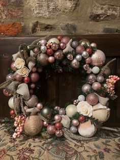 a christmas wreath with ornaments hanging from it