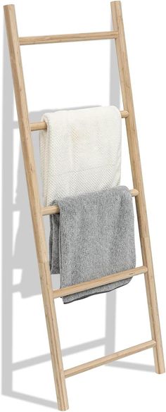 a wooden ladder with two towels on it