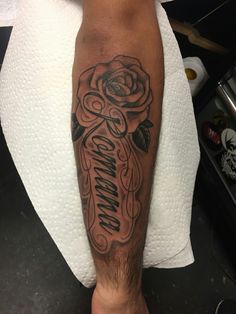 a man with a rose tattoo on his leg