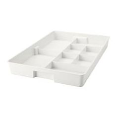 an empty white tray with compartments on it