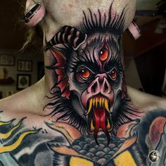 a man with a tattoo on his neck has an evil demon face and dragon teeth