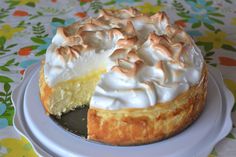 a lemon meringue pie is on a plate