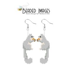 a pair of earrings with an image of a bird on it's face and the words beaded images