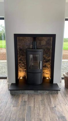 a wood burning stove sitting inside of a living room