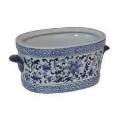 a large blue and white pot with handles