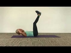 a woman is doing an exercise on her yoga mat