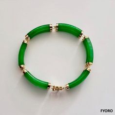 Our 'Fu Fuku Fortune Jade Bracelet' embodies radiance and stature, with hand carved jade lengths intertwined with 14K Gold; a unisex statement. Our top craftsman signs off the piece with a crafted symbol of fortune at the clasp. The Han symbol for fortune and luck evokes an unrivaled sense of positivity and happiness. Materials: 2.10g 14K Gold and 16.40g Jadeite (Approximately) Dimensions: 185 x 10 x 8 mm Gross Weight: 18.50 g Luxury Jade Bracelets For Formal Occasions, Luxury Formal Jade Bracelets, Formal Yellow Gold Jade Bracelets, Formal Yellow Gold Jade Bracelet, Luxury Gold Jade Bracelets, Elegant Yellow Gold Jade Bracelets, Elegant Yellow Gold Jade Bracelet, Jade Dragon, Purple Jade