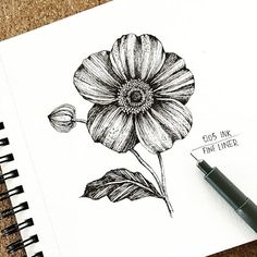 a drawing of a flower with the words god ink fine liner