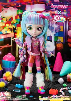 a doll with blue hair and colorful clothes in front of a room full of toys