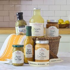 a variety of condiments are arranged in a basket