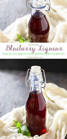 a bottle of blueberry liquer sitting on top of a white cloth covered table