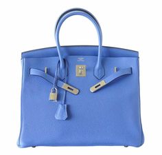 Bag: Hermès Birkin Bag Size: 35cmColor: Bleu ParadisMaterial: Clemence Leather Hardware: PalladiumMeasures: 35x28x18cm (14"x11"x7")Condition : Pristine Includes: Lock, Keys, Sleeper, Raincoat, Signature Orange Hermès Box This Hermès Birkin in size 35 is a true beauty and incredibly hard to find anywhere else. The Bleu Paradis color pops and lets you stand out from the crowd everywhere you go. Made from Clemence leather, one of the most desired leathers in the entire Hermès collection. It’s accentuated with exquisite palladium hardware for an ultra-classy appearance. As a very rare and valuable bag, this Birkin by Hermès is sought after worldwide. Don’t miss out on this gorgeous Birkin and treat yourself to the last bag you’ll ever want to own. Note: Our Items are totally New High quality B Summer Magic, Dream Bag, Hermes Birkin 35, Hermes Box, Bag Collection, Hermes Birkin, True Beauty, Birkin Bag, Hermes Bag Birkin