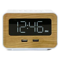 the alarm clock is made from wood and has two usbs