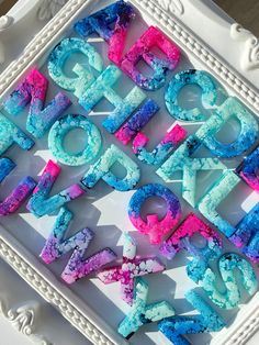 there are letters made out of colored powder in the shape of words that spell out love