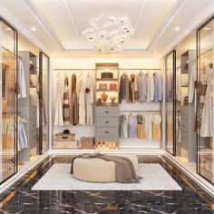 a walk in closet filled with lots of clothes and shoes on shelves next to a chandelier