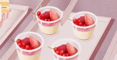 four cups filled with fruit sitting on top of a table next to a plate full of cake