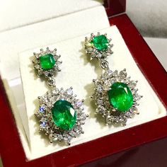 ONE OF A KIND HANDCRAFTED EARRINGS. STUNNING 7.08TCW, Certified ZAMBIAN Emerald earrings. UNIQUE DESIGN! ONE OF A KIND! PERFECT DANGLING EARRINGS FOR EVERY OCCASION! Everlastingly precious with genuine, untreated emeralds and natural diamonds, set in handcrafted 18K solid white gold earrings. What you see is what you get! One of a kind earrings! Our jewelry are specially designed, and are delicately handcrafted by local Thai, professional goldsmiths, who have had decades of experience in creatin Luxury Emerald Jewelry With Halo Design, Formal Fine Jewelry Chandelier Earrings, Gia Certified Drop Jewelry For Formal Occasions, White Gold Emerald Fine Jewelry Earrings, Emerald Earrings With Brilliant Cut For Wedding, Luxury Halo Design Dangle Jewelry, Formal Emerald Jewelry With Halo Design, Formal Round Chandelier Earrings In Fine Jewelry Style, Elegant Gia Certified Emerald Earrings