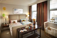 A deluxe bedroom fully set up to welcome the little ones - special bedding, cots, snacks and activities mean Brown's Hotel is the place to stay in London with kids