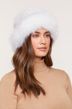 Two supreme furs in one elegant hat give your winter wardrobe an upgrade. Our Knitted Danish mink fur tails hat is framed at the brim with a fluffy Finnish blue fox fur ruff for a feminine finish. Warm, soft, and lightweight, this pretty hat perks up winter days and nights while insulating you from the cold. Winter Hat With Feather Trim, Fluffy Faux Fur Hat For Fall, Fluffy Faux Fur Hat For Cold Weather, Faux Fur Hat For Fall, Fall Hats With Faux Fur Lining, Faux Fur Beanie Hats For Fall, Faux Fur Beanie For Fall, Fall Faux Fur Beanie Hat, Fall Faux Fur Hat With Lining