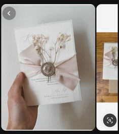 a hand is holding a card with flowers on it and the other side has a bow