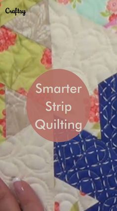 a quilter's hand is stitching on the side of a blue and white quilt