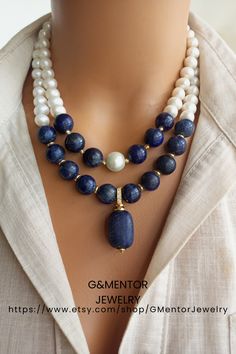 A timeless accessory that embodies natural beauty, our elegant Pearl and Lapis Lazuli Necklace combines lustrous freshwater pearls, known for their lustrous and iridescent appeal, with the deep blue appeal of genuine Lapis Lazuli gemstones. Handmade with love and attention to detail, this stunning necklace exudes a sense of opulence and elegance. Elegant Single Strand Beaded Necklace, Elegant Gold Beaded Necklace With Gemstone Accents, Fine Jewelry With Sapphire Stones, Fine Jewelry Sapphire Stones, Elegant Formal Single Strand Crystal Necklace, Elegant Double Strand Gemstone Beads Necklaces, Spiritual Pearl Jewelry With Gemstone, Elegant Blue Single Strand Jewelry, Double Strand Pearl Necklace With Natural Stones