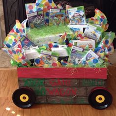 a wooden wagon filled with books and candy