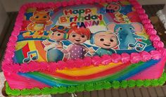 the birthday cake is decorated with cartoon characters