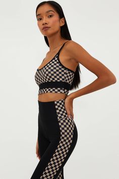 The Eva Top is our versatile top that can take you from the beach to the gym and everywhere in between. This top features color blocking in our ultra-soft luxe ribbed fabric with adjustable straps and a thick band under the bust for extra support. Now in our Taupe & Black checkered print combo. Pair with the matching Emmy Bottom and Colorblock legging for a full swim and sport look. Sport Look, Black Checkered, Checkered Print, Checker Print, Beach Tops, Ribbed Fabric, Spandex Fabric, The Gym