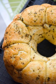 a freshly baked bread with herbs on top