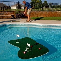 a man is playing golf in the pool